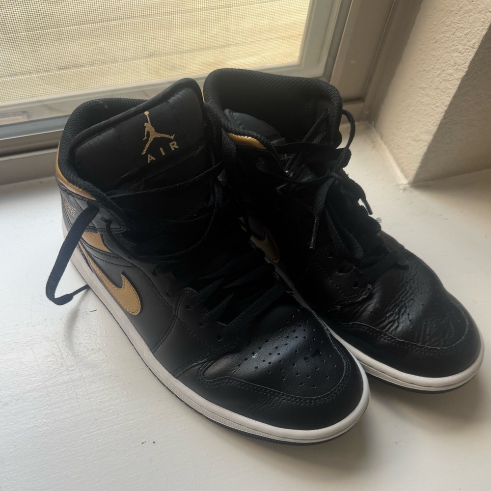 Jordan Black and Gold High-Top Sneakers